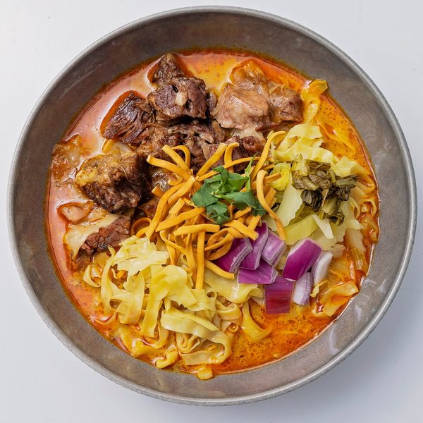 Bowl of slow-cooked beef khao soi